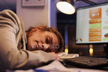 e after working overtime at financial strategy to increase company profit. Tired businesswoman falling asleep in startup office. Corporate concept