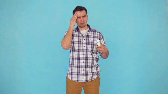 a Middleaged Man in a Shirt Uses a Protective Cream