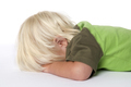 Little crying blond toddlerboy lying on the floor - PhotoDune Item for Sale
