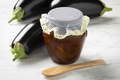 Glass jar with eggplant chutney and fresh eggplanst on the side - PhotoDune Item for Sale