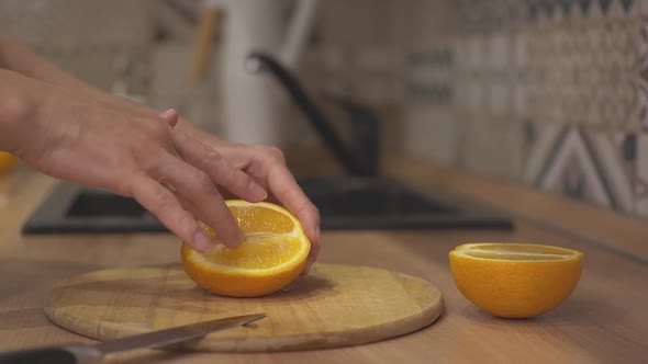 a Girl Strokes a Tender Orange