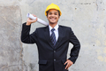 Happy Asian engineer man holding project paper plan - PhotoDune Item for Sale