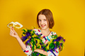 A joyful teenager girl wearing a colorful Brazil carnival mask - PhotoDune Item for Sale