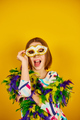 A joyful teenager girl wearing a colorful Brazil carnival mask - PhotoDune Item for Sale