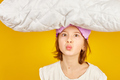 Funny teenage girl in white pyjamas with a violet sleeping mask hold pillow - PhotoDune Item for Sale
