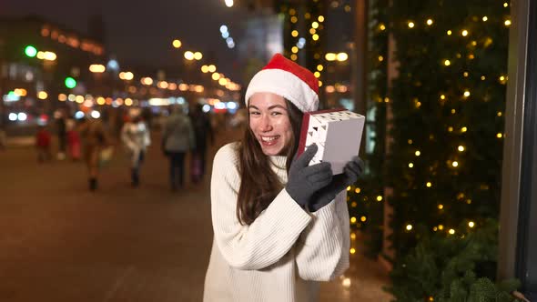 Night Street Portrait of Young Beautiful Woman Acting Thrilled