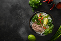 Pho Bo Soup with beef in bowl on black background. Vietnamese cuisine. - PhotoDune Item for Sale