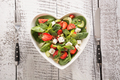 Fresh salad of strawberry, celery, spinach, pine nuts, cheese in plate as heart. - PhotoDune Item for Sale