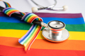 stethoscope on rainbow flag background, symbol of LGBT pride month  celebrate annual in June. - PhotoDune Item for Sale