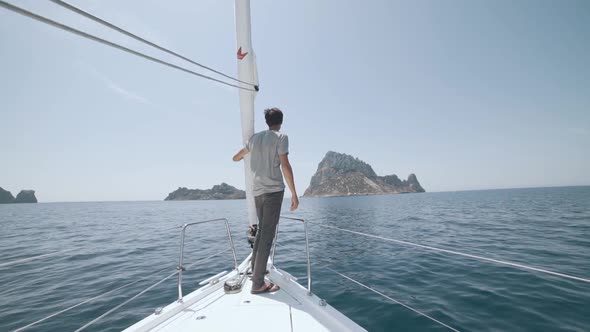 Beautiful White Yacht Breaks the Waves