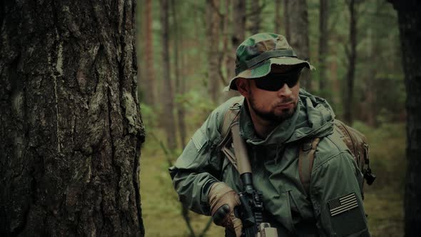 Soldier with Assault Rifle and a Backpack on a Patrol