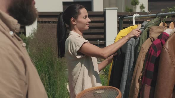 Man and Woman at Garage Sale