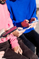 hands of three young adults using mobile phones - PhotoDune Item for Sale