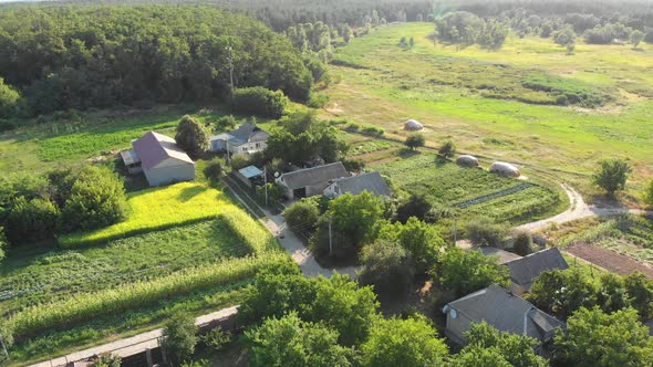  Aerial View of the Countryside and Small Village with Green Fields and Meadows