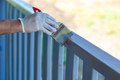 Painting a wooden board with a gray brush. Selective focus. - PhotoDune Item for Sale
