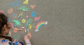 Children draw with chalk on the pavement. Selective focus. - PhotoDune Item for Sale