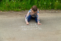 Children draw equations on the pavement with chalk. Selective focus. - PhotoDune Item for Sale