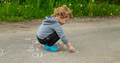 Children draw equations on the pavement with chalk. Selective focus. - PhotoDune Item for Sale