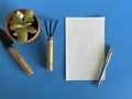 Paper, pen with succulent and garden tools  - PhotoDune Item for Sale