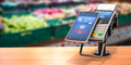 Contactless  payment with smart phone. POS terminal with NFC mobile phone in asupermarket. - PhotoDune Item for Sale