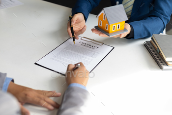 terms of the home purchase contract. Businessman signing a contract agreement, mortgage, rent, lease, home insurance.