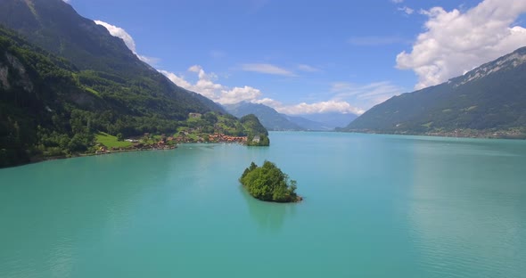Aerial travel drone view of Iseltwald, Lake Brienz, Switzerland.