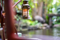 Old dimly lit Vintage Lantern Hanging on a solid metal pole. - PhotoDune Item for Sale