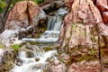 waterfall flowing rapidly over rocky cliffs - PhotoDune Item for Sale