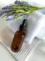 Essential oil on white towels with lavender  - PhotoDune Item for Sale