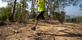 Woman trail runner running at tropical forest mountain peak - PhotoDune Item for Sale