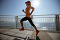 Healthy lifestyle fitness sports woman runner running up stairs on seaside trail - PhotoDune Item for Sale