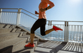 Healthy lifestyle fitness sports woman runner running on seaside trail - PhotoDune Item for Sale