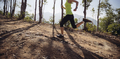 Woman trail runner running at tropical forest mountain peak - PhotoDune Item for Sale