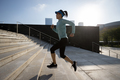 Fitness sports woman running up stairs in city - PhotoDune Item for Sale
