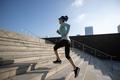 Fitness sports woman running up stairs in city - PhotoDune Item for Sale