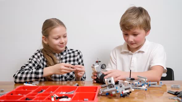 Young Friends Having Fun, Using Building Kit.