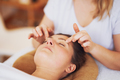 Woman having japan style face massage in salon - PhotoDune Item for Sale