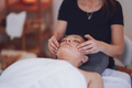 Woman having japan style face massage in salon - PhotoDune Item for Sale