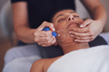 Woman having a face cupping massage in salon - PhotoDune Item for Sale