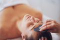 Brunette woman having a stone massage on face - PhotoDune Item for Sale