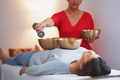Woman having a Tibetan sound bowl massage - PhotoDune Item for Sale