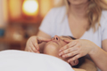 Woman having a face massage treatment in studio - PhotoDune Item for Sale