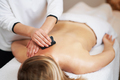 Woman having a gua sha massage in salon - PhotoDune Item for Sale