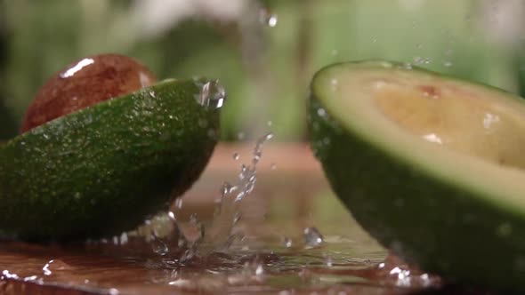 Avocado Falling and Divide in Slow Motion alt