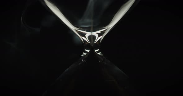 Sand moving in an upside down hourglass