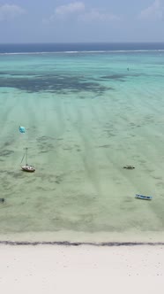 Vertical Video Kitesurfing Near the Shore of Zanzibar Tanzania