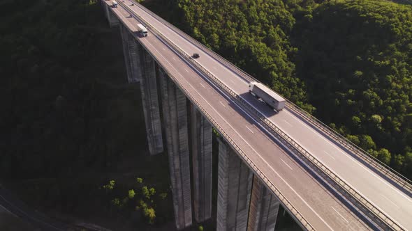 Drone Follows Loaded White Semitruck Driving on Bebresh Viaduct