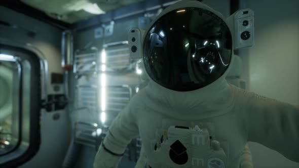 Astronaut Inside the Orbital Space Station alt