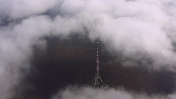 Television Tower Antenna in the Fog at the Summer Day Aerial View