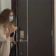 Mixed Race Young Woman Takes Off Disposable Face Mask - VideoHive Item for Sale